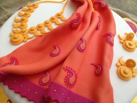 Close-up of Saree & jewellery 50th cake